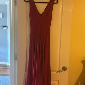 Red gown,. Front is shorter than the back. Ribbed top,flows at the bottom.